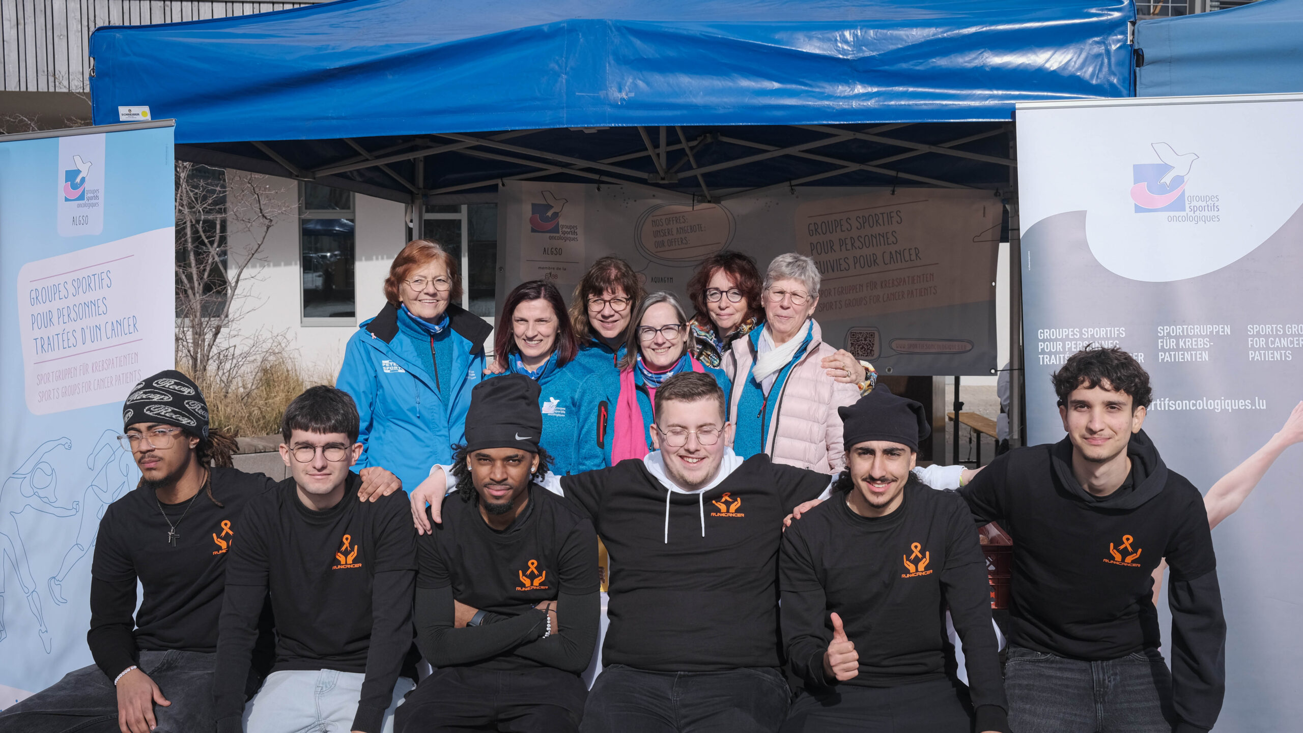 The students who organised Run4Cancer 2024 posing with some ALGSO members