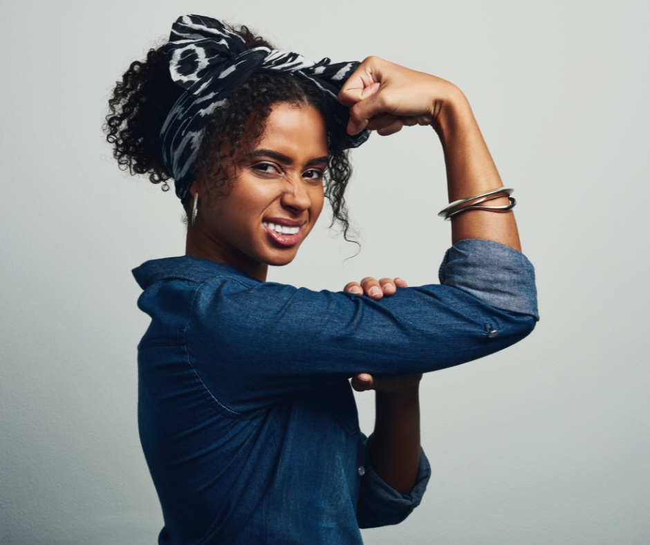 an empowered woman flexing her arm