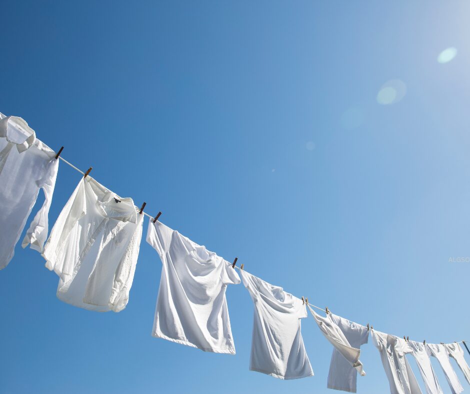 white linen and cotton shirts on a clothesline