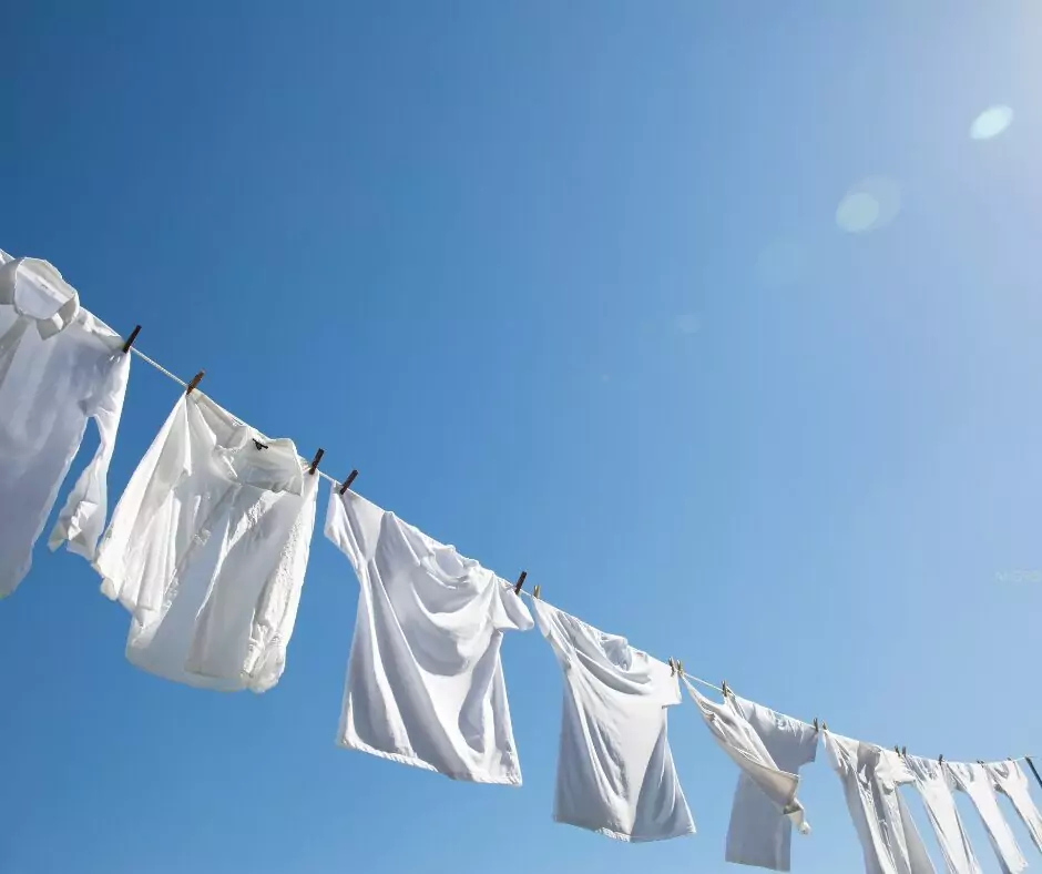 white linen and cotton shirts on a clothesline